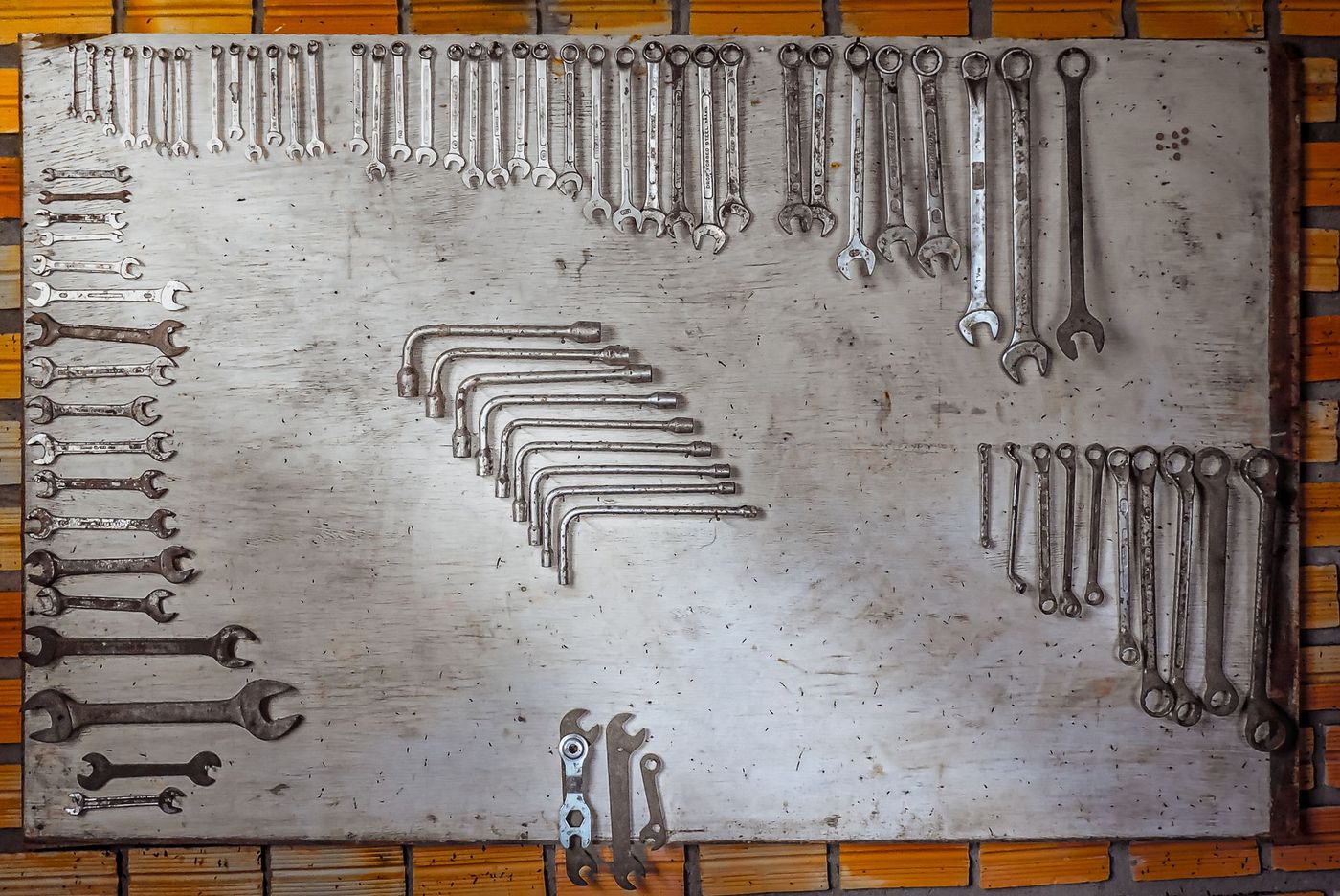 An organised board of spanners and wrenches laid out by size — a stock photograph, not JM Mobile Mechanic's own tools